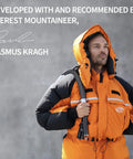 Person wearing an orange and black mountaineering jacket, holding an ice axe, with text about Everest mountaineer endorsement.