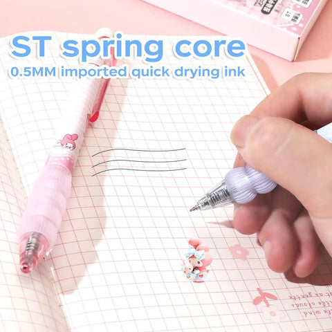 Writing with Cartoon Ballpoint Pen 5 Pack With Spring Loaded Tip And Soft Silicone Grip Sleeve on notebook.