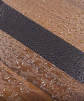 Close-up of Heavy Duty Wide Duct Tape 3 Inch By 55 Yards Waterproof All Weather Industrial Strength Tape on wet surface