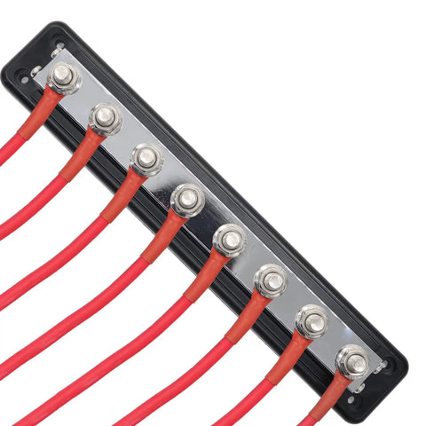 Hella Heavy Duty Copper Bus Bar Providing 600 Amp Juice For Rock Solid 8 Way Distribution Block Grounding And Smooth Auto Battery Wiring In Classic Red And Black from a top view showing M10 studs and red wiring.