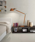 Modern bedroom with a wooden lamp, books, and decor on a shelf, displaying a 4.6L Digital Steel Safe With Electronic Lock For Home Or Office.
