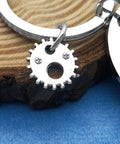 Engineer Solving Problems You Didnt Know You Had Keychain Gift For Engineering Students with gear charm on wooden background