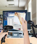 Plug And Play USB Barcode Scanner Laser Wired Handheld With Stand For Windows Mac Linux POS Systems in use for book scanning