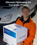 Delivery person holding a discrete package with shipping van in background, ensuring complete privacy.