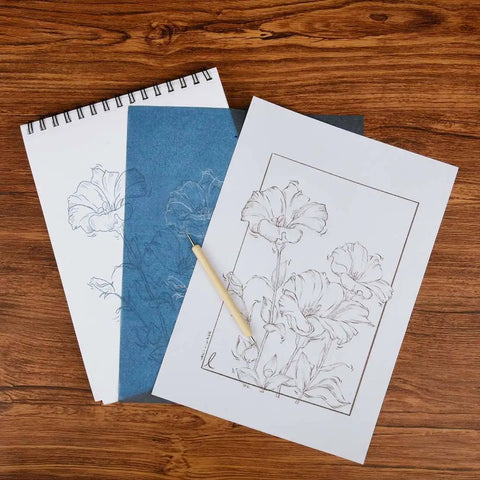 Color Carbon Transfer Paper Set With 50 Sheets In Red Yellow Blue Green White 9x11 Inch Graphite Paper And 5 Stylus Tools displayed on wooden surface with outlined flower design.
