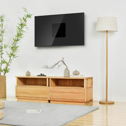 Super Slick Vesa Mount Adapter Plate For Flat And Curved TV Universal Conversion Bracket mounted on a stylish wall above a wooden cabinet.