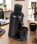 Badass Variable Speed Coffee Grinder With 80Mm Flat Burr And 800 To 1600 Rpm Dial showcasing sleek black design on wooden table.