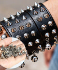 Close-up of spiked black leather cuff adorned with silver studs and bells, showcasing Badass 543 Piece Punk Studs And Spikes Kit.