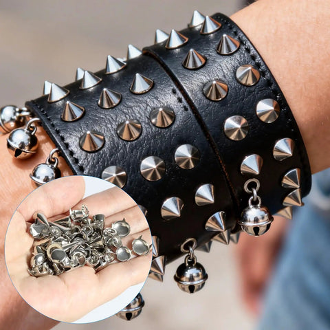 Close-up of spiked black leather cuff adorned with silver studs and bells, showcasing Badass 543 Piece Punk Studs And Spikes Kit.