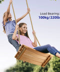 Two kids enjoying Wooden Tree Swing Seat For Indoor And Outdoor Fun With Adjustable Rope, Non Slip Ridged Seat And Raised Sides