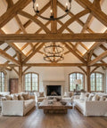 Spacious living room featuring wooden beams, large windows, and a wooden coffee table, ideal for showcasing Premium Oil Based Penetrating Interior Wood Stain With Low Voc Levels For A Dang Good Natural Wood Look That Glides On Easy And Enhances Real Grain Texture In A Handy Half Pint Can.