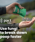 Person pouring green Pact Tabs into hand for Ultra Lite Outdoor Bathroom Kit for Hiking, Trail Running, Mountain Biking, and Bikepacking.