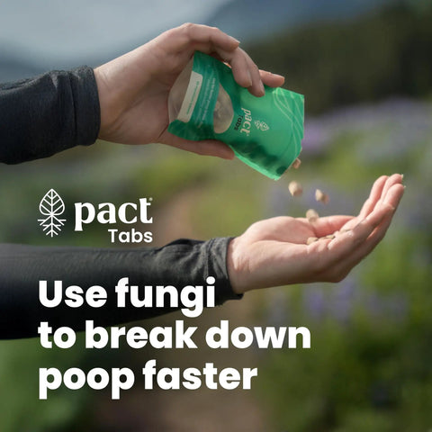 Person pouring green Pact Tabs into hand for Ultra Lite Outdoor Bathroom Kit for Hiking, Trail Running, Mountain Biking, and Bikepacking.