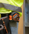 Heavy Duty Tape Measure With 30 Foot Double Hook, Double Sided Nylon Reinforced Blade on belt of contractor in work gear