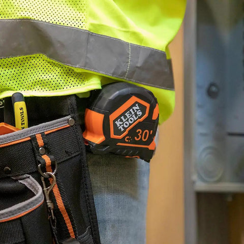 Heavy Duty Tape Measure With 30 Foot Double Hook, Double Sided Nylon Reinforced Blade on belt of contractor in work gear