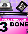 Pink Zipper Pull Installer Tool for easy zipper pull replacement in sewing and quilting projects displayed on grid mat.