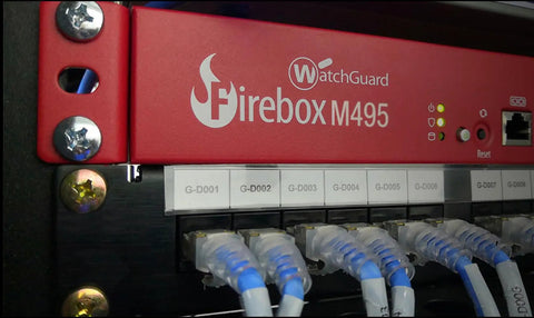 Heavy Hitting Rackmount Enterprise Firewall With Three Year Security Coverage Featuring Multi Gig Ports SD Wan Integration And Tls Decryption For Rock Solid Protection On Any Business Network, showcasing red metal casing and multiple Ethernet ports.