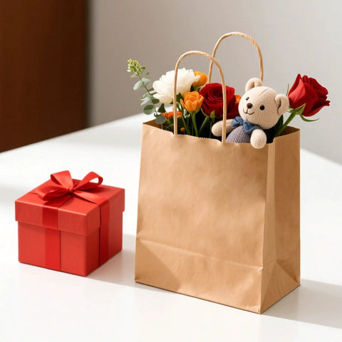 Kraft Paper Gift Bags With Handles Bulk Pack 100, 8x4.5x10.8 Inch Recyclable Shopping Bags containing flowers and toy, next to red gift box
