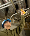 Boss Level HVAC Pro Infrared Thermometer With Dual Infrared And Thermocouple Modes, Reads Minus Forty To One Thousand Twenty Two Degrees Fahrenheit (Forty To Five Hundred Fifty Celsius), Perfect For HVAC And Refrigeration, Electrical, And Industrial Work. HVAC tech using infrared thermometer near insulated ducts