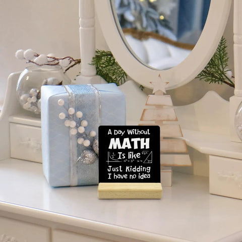 Wooden desk sign reading 'A Day Without Math' on a dresser with holiday decor, Funny Math Teacher Gift For Classroom Nerds Women And Men Desk Wood Sign A Day Without Math Must Have Office Decor Great Gift For Teachers And Classroom Decor Enthusiasts For Desk Or Wall Display.