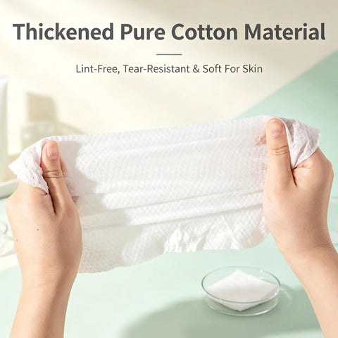 Hands holding a thickened pure cotton towel showing its soft, lint-free texture from the 14 Pack Compressed Travel Towel Tablets Ultra Absorbent Water Activated Compact Cloth Dudes Swear By These Fast Expand Wipes For Camping Hiking And Road Trips.