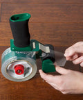 Hands holding a tape dispenser with EZ Start Packing Tape Refill Four Roll Bundle 1.88 Inch By 54.6 Yard Clear Frustration Free Unrolls Smoothly Whisper Quiet Release For Home Office Use