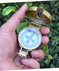 All In One Portable Hiking Compass With Carabiner For Camping And Backpacking Quick Reading Map Needle Durable Keychain in hand
