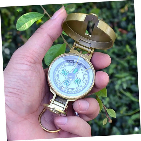 All In One Portable Hiking Compass With Carabiner For Camping And Backpacking Quick Reading Map Needle Durable Keychain in hand