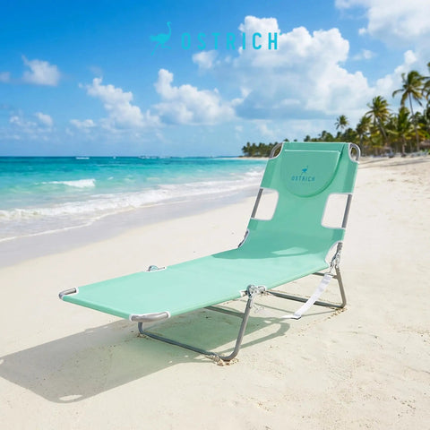 Teal Open Face Chaise Lounge With Face Cavity Design, Arm Slots, And Plush Pillow, Ultra Lightweight Foldable Tanning Lounger on beach