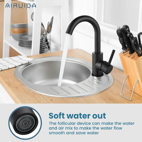 Matte Black Single Hole Bathroom Faucet With 360 Degree Swivel Spout in modern kitchen setup, showing water flow feature.