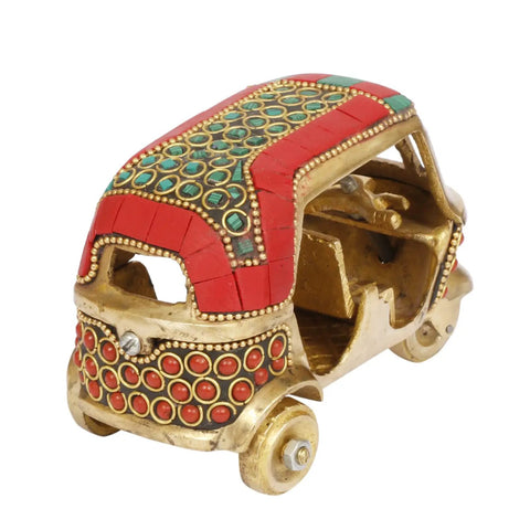 Sick Red Brass Auto Rickshaw Replica With Stone Studded Details Classic Indian Tuk Tuk Model Display Piece showing intricate design and vibrant colors.