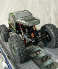 RC crawler on ramp with 51mm Long Travel Shocks For Axial AX24 SCX24 RC Crawler Upgrade Double Barrel Threaded Dampers CNC Machined Aluminum Bodies.