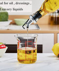 Borosilicate Glass Measuring Cup 1 Cup 8oz with Spout pouring oil in kitchen setting