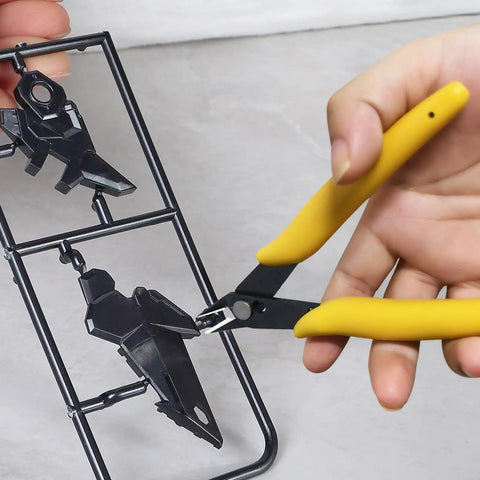 Pro Grade 20Pcs Gunpla Model Tools Kit for easy assembly showing yellow-handled pliers cutting plastic model parts
