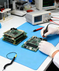 Front view Fabater ESD anti-static mat on blue work surface with grounding wire for electronics repair