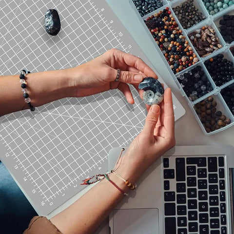 Thickened Pro Grade Self Healing Cutting Mat 18x12 Inches Double Sided 5 Ply Rotary Cutting And Sewing Surface For Fabric Quilting Leather Crafts Hobby Projects Grey Black used as surface for crafts near beads and laptop