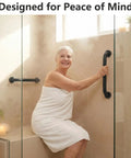 Rock Solid 16 Inch Wall Mount Handrail Matte Black Steel Pipe Grab Bar installed in a bathroom for safety support.