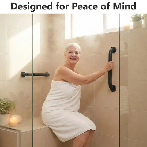 Rock Solid 16 Inch Wall Mount Handrail Matte Black Steel Pipe Grab Bar installed in a bathroom for safety support.