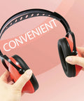 Kid Safe Noise Reduction Ear Muffs With Plush Cushions For Toddlers, Kids And Teens, Coral, being held by a hand on pink background.