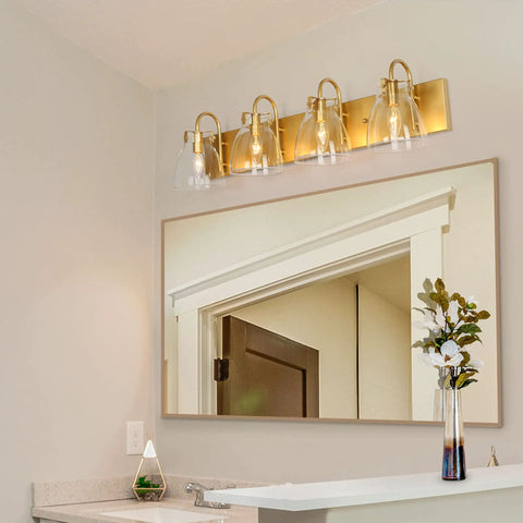 Gold Vanity Light Fixture With Clear Glass Shades, Four Light Over Mirror Bathroom Lighting in elegant spa-worthy bathroom