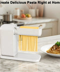 Electric Pasta Maker With Roller And Cutters For Fresh Noodles. High Quality Food Safe Machine in white with fresh noodles.
