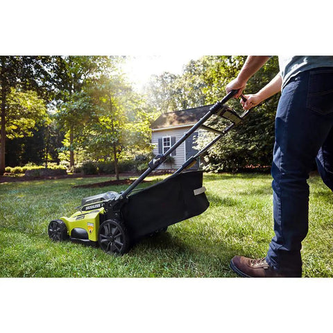 Cordless Push Lawn Mower 20-Inch 40-Volt Brushless With Whisper Quiet Design No Gas Needed Yet Delivers Real-World Power Load-Sensing Motor Long Battery Life Lightweight And Low Noise For Effortless Yard Care. Push mower with bag attached on green lawn