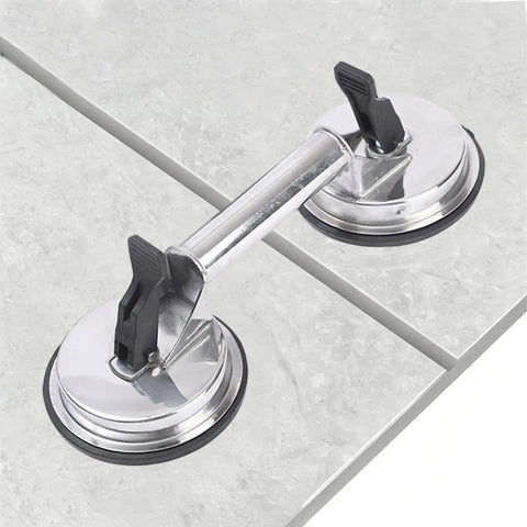 Heavy Duty Glass Suction Cup With Stainless Steel Handle For Lifting Heavy Tiles Smooth Panels And Glass attached to tile surface.