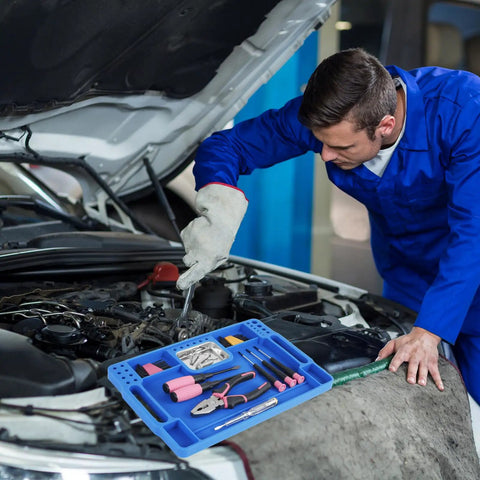 Mechanic using a Blue Silicone Tool Tray For Auto Repairs Flexible Magnetic Tool Holder With Small Parts Tray on a car engine