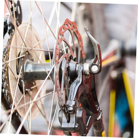 Top Shelf Front And Rear Disc Brake Rotor Kit For Mountain Bikes With Silver Aluminum Build 160mm Diameter Mechanical Setup Dual Knob Adjustment To Legit Crush Every Gnarly Trail, close-up of rear brake rotor and caliper.