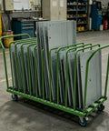 Rock Solid Shop Beast Steel Cart For Hauling Sheet Metal Plastic Glass And Wood Panels With Scratch Free Multi Slot Rack System And No Sweat Smooth Roll Wheels loaded with flat metal sheets.