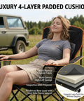 Woman relaxing on Oversized Padded Camping Chair Two Pack Heavy Duty Quad Chair with Lumbar Support outdoor setting.