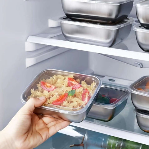Five Piece Stainless Steel Storage Containers Set With Clear Lids holding pasta in refrigerator