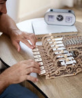 Mechanical Celesta Wooden Puzzle Kit For Adults, 3D DIY Musical Instrument That Doubles As A Functional Mini Piano, Music Box And Xylophone Brain Teaser, 4.7 Inch Tall Wood Model, on table