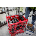 Top Shelf Tool Storage Crate Built Like A Tank For Milwaukee Packout Compatibility Featuring A No Nonsense Fifty Pound Weight Rating And Slick IP65 Weatherproof Shield For Your Daily Grind And Heavy Equipment showcasing organized tools inside in a work setting.